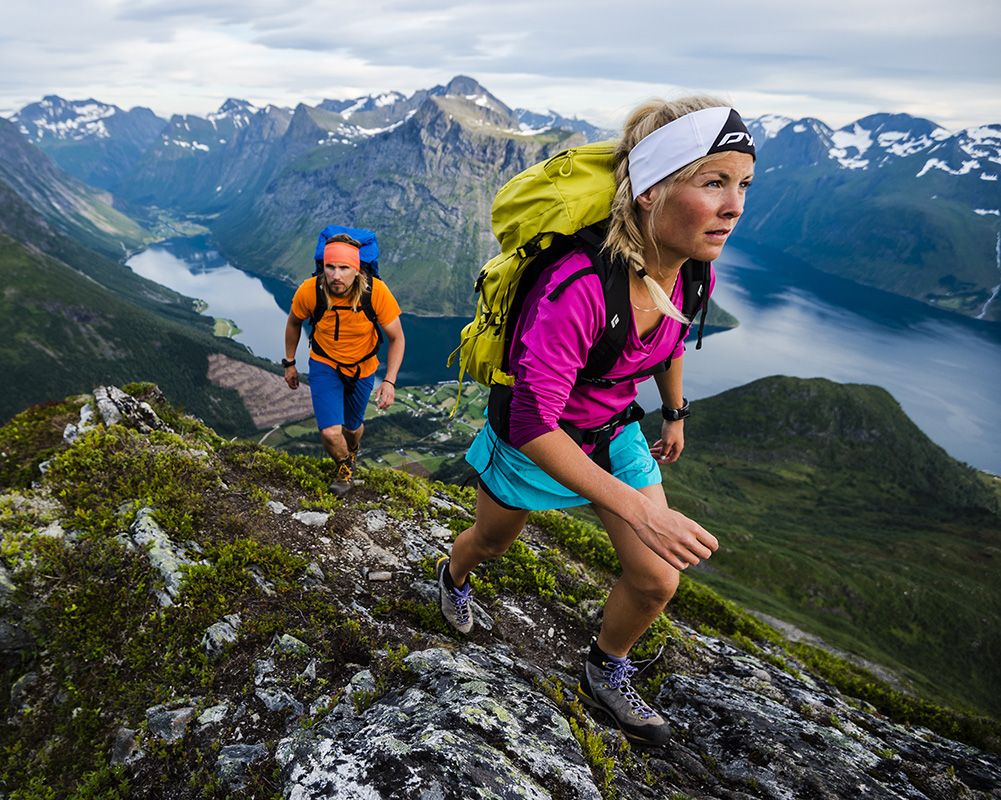 Strenuous hiking excursion on the mountains surrounding a fjord