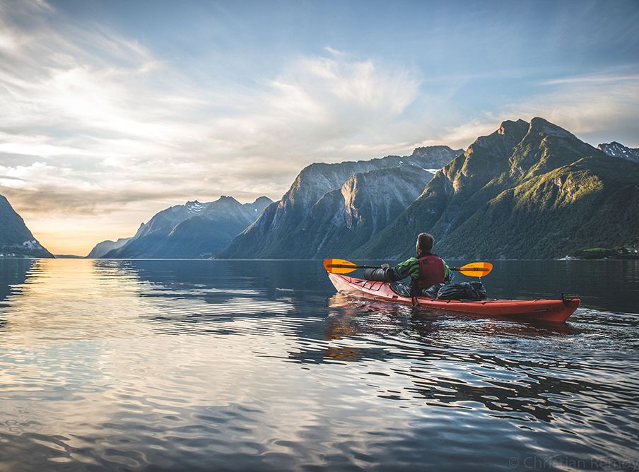 Kayaking excursion in Hjørundfjord Fjord during summer in Norway