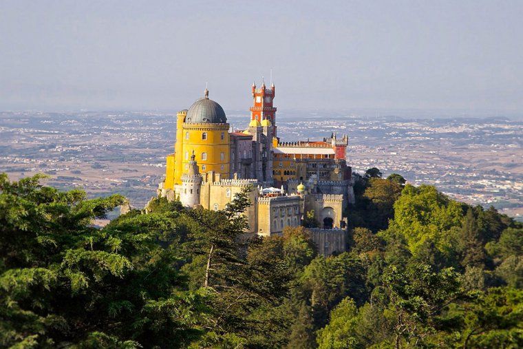Colorful Pena Palace sits on a forested hilltop in Sintra