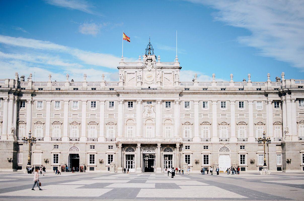 Facade of the Royal Palace in Madrid, Spain from across a plaza