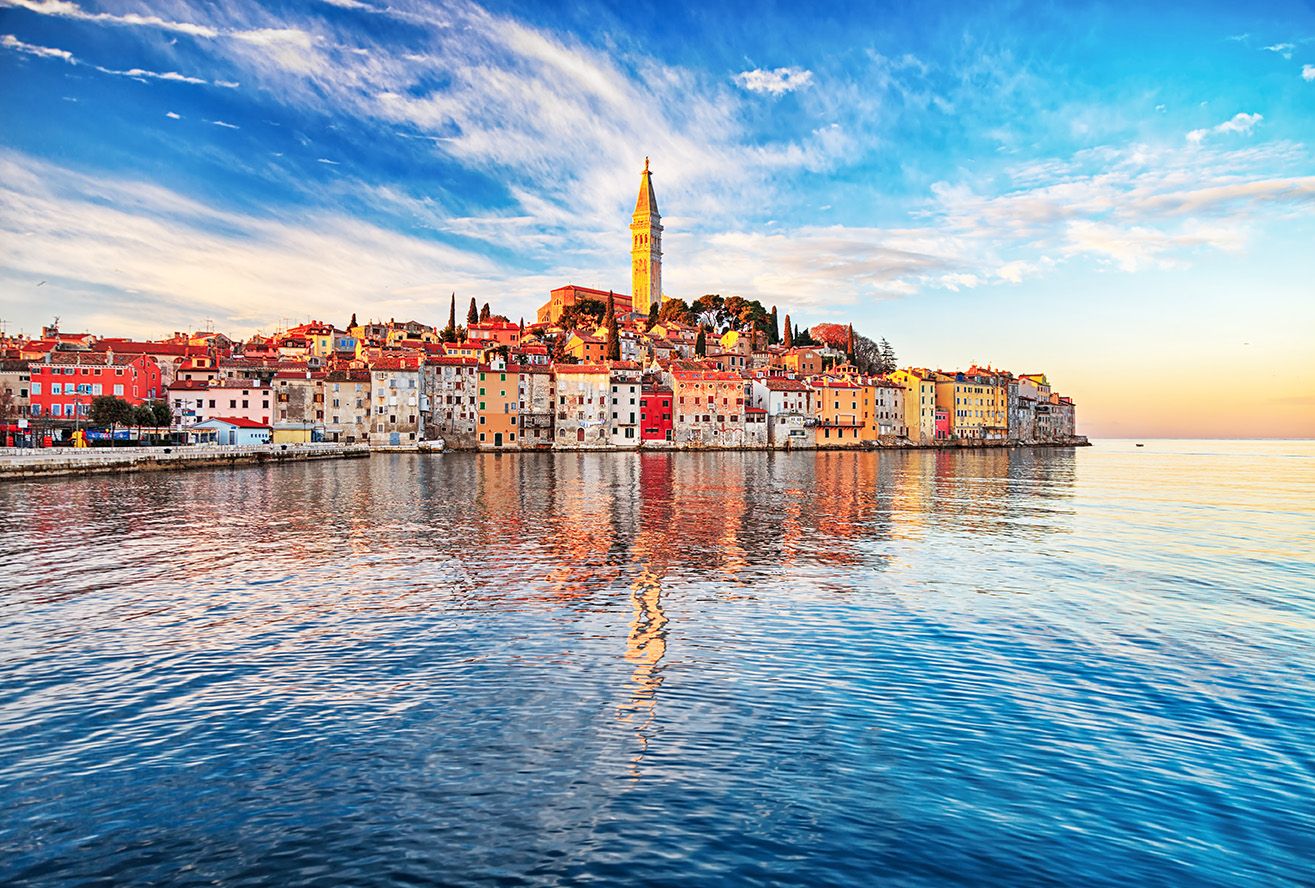 Colorful Old Town of Rovinj on Istria Peninsula seen from the sea at sunset