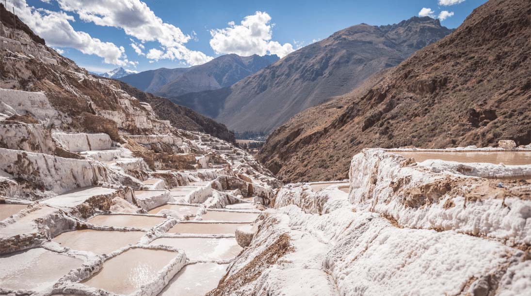 Shallow, rectangular, terraced salt ponds on a Peruvian mountainside used by families from Maras to harvest salt