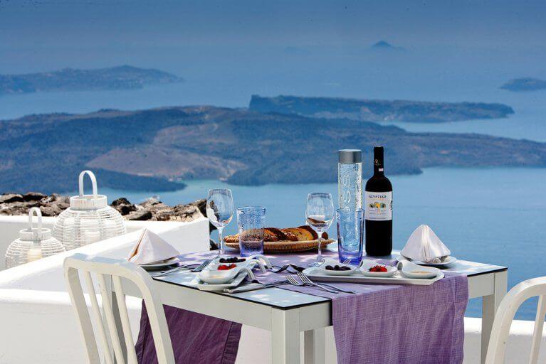 Gourmet lunch al fresco with a view of the sea in Santorini