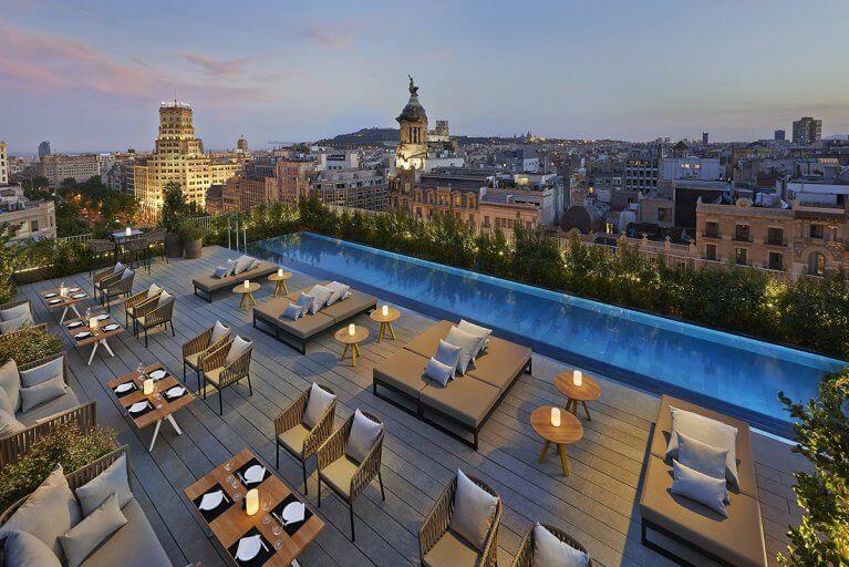 Tables set for dinner on a rooftop in Barcelona, Spain