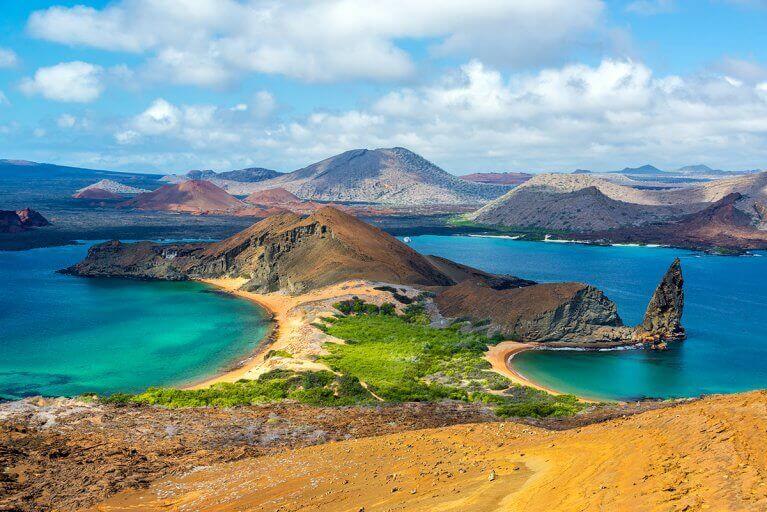 Rocky peninsula with sandy beaches on Bartolome Island in Galapagos archipelago