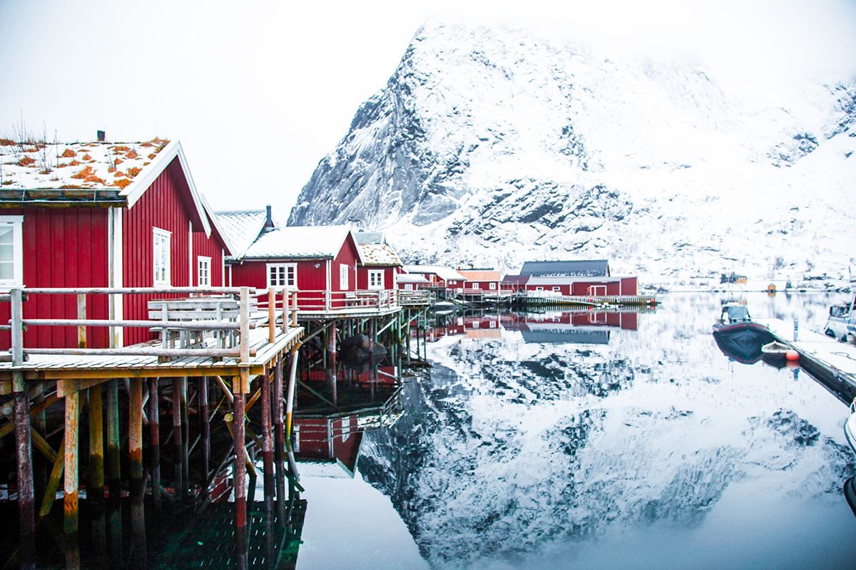 Fisherman's cabins reflected in the sea