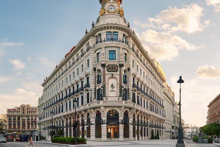 Exterior of luxurious Four Seasons hotel from a street corner in Madrid, Spain
