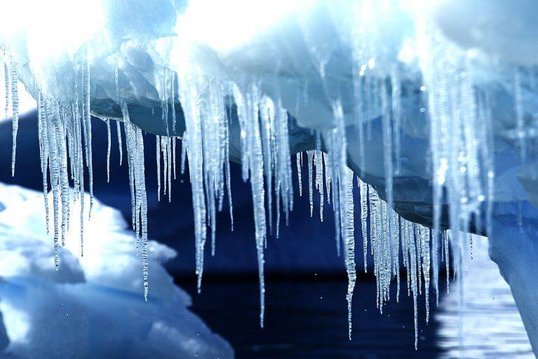 Closeup photo of icicles hanging in an ice cave