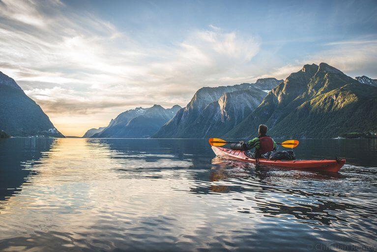 Kayaking excursion in Hjørundfjord Fjord during summer in Norway