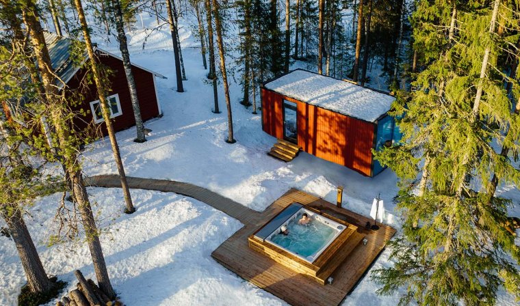 Aerial view of luxury wilderness lodge and private outdoor jacuzzi