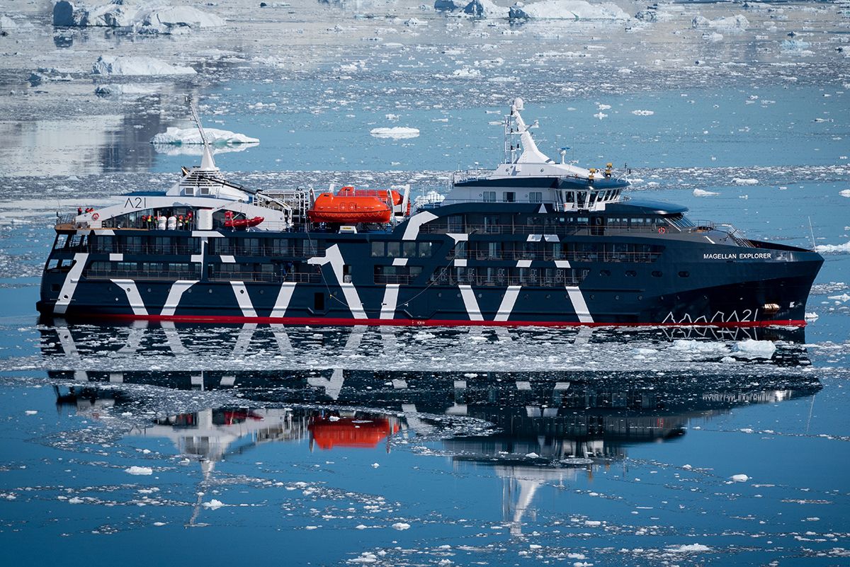 The Magellan Explorer cruising through icy waters in Antarctica during a luxury fly and sail cruise in Antarctica