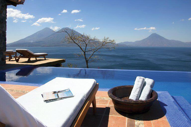 Relax by an infinity pool with views of the mountains and Lake Atitlan