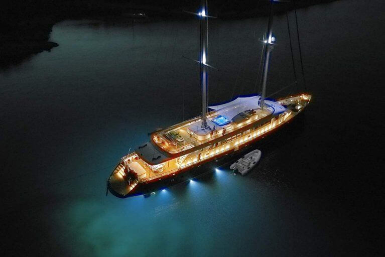 Private luxury yacht with lights on in the Adriatic sea at night