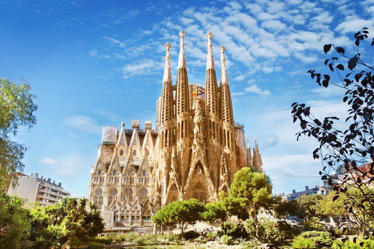 Sagrada Familia Cathedral seen from park in Barcelona, Spain on a sunny day