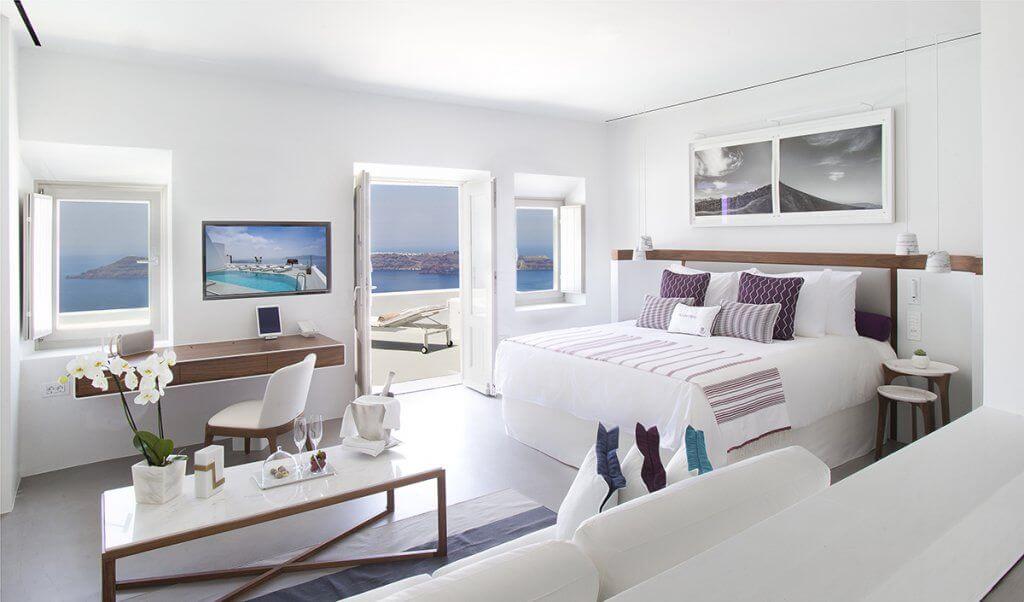 White suite with a view of Aegean sea at Grace luxury hotel in Santorini