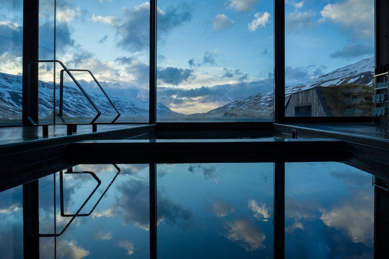 Indoor thermal baths with glass windows overlooking mountains
