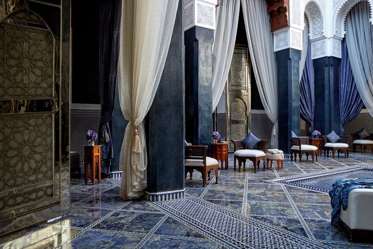 Lobby with blue tilework and white curtain at the Royal Mansour luxury hotel in Marrakesh