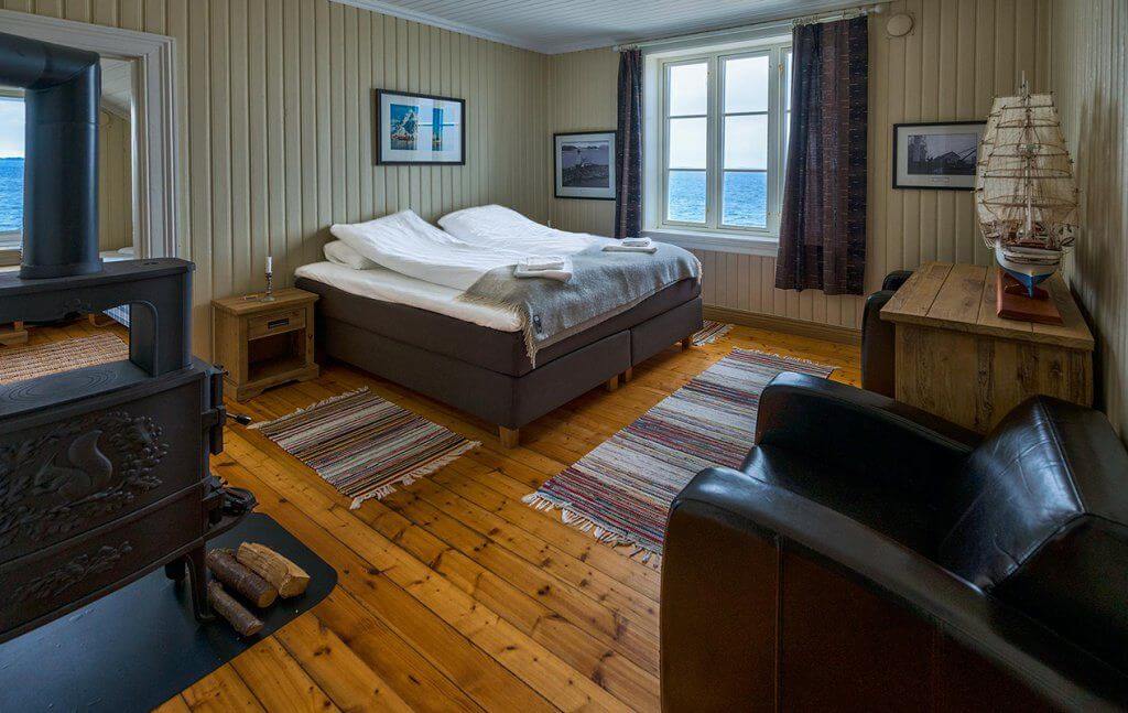 Bedroom with sea view at Lighthouse Hotel in Norway