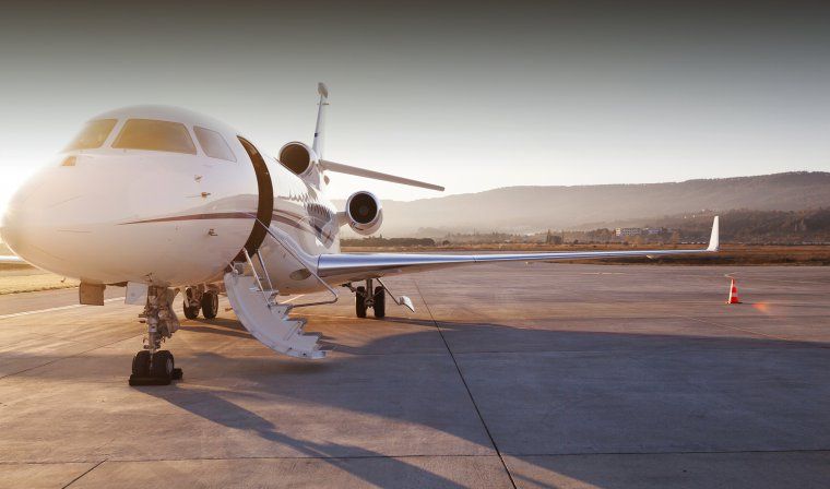 Private jet sits on the tarmac with door open