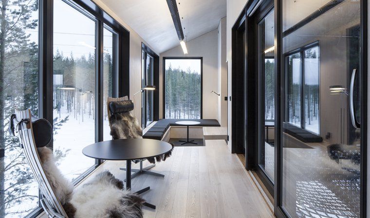 Interior view of a room in Treehotel with view of forest in Swedish Lapland