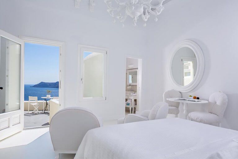 Inside a Superior Suite with ocean views at a luxury hotel in the city of Oia in Santorini