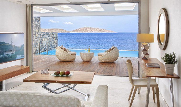 Waterfront views of Aegean sea from Junior Suite room with private pool at luxury hotel in Greece