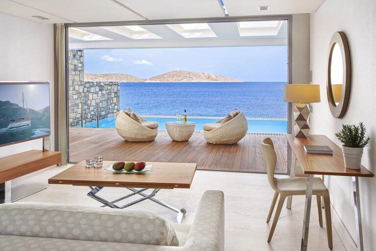 Waterfront views of Aegean sea from Junior Suite room with private pool at luxury hotel in Greece