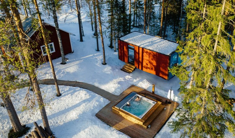 Luxury private wilderness lodge with hot tub in Lapland, Sweden