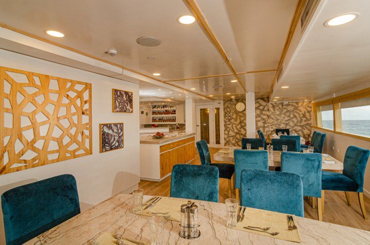 Elegant indoor luxury dining area of Galapagos Sea Star yacht