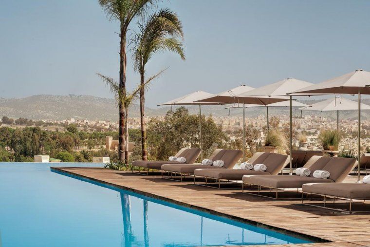 Outdoor pool with views of Fes at Hotel Sahrai