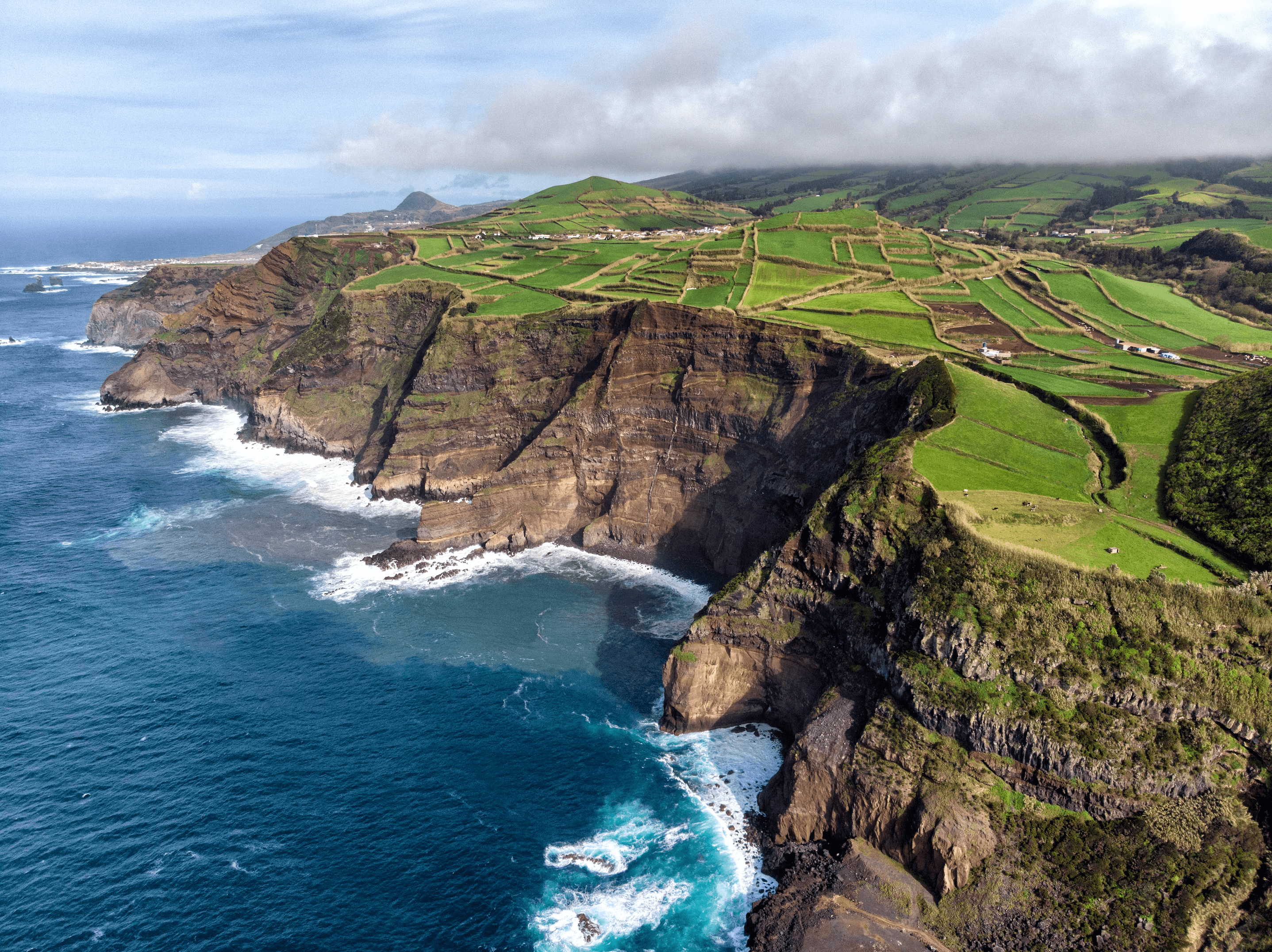 Stunning views of green hills next to coastline on Sao Miguel Island
