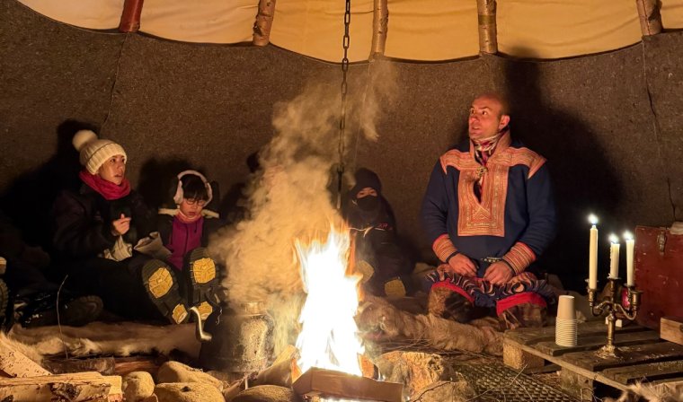 A cozy bonfire in a tent during a winter's evening in Alta in Norway
