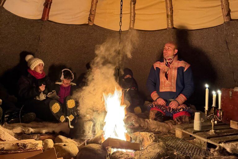 A cozy bonfire in a tent during a winter's evening in Alta in Norway