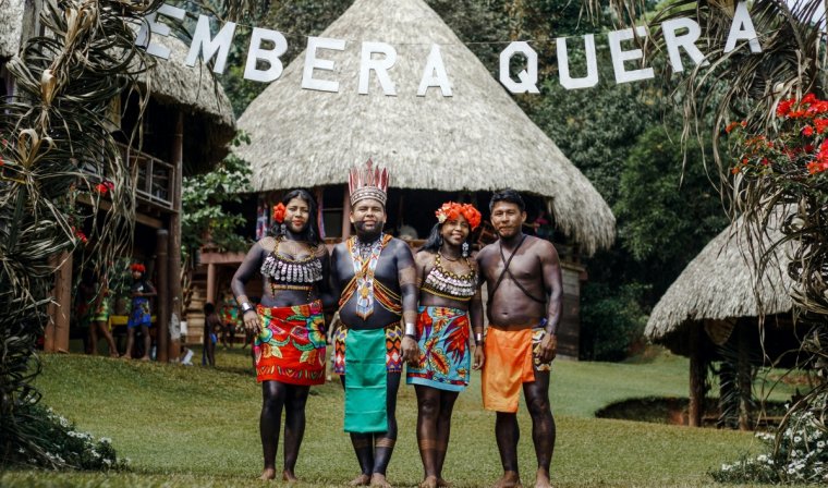 Indigenous Embera people welcoming travelers to their village in Panama during cultural experience