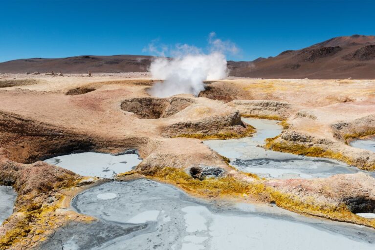 Geysers with steam coming out of them in Uyuni