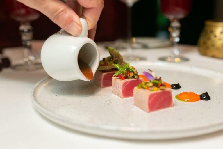 Private chef serving gourmet food during luxury Panama tour