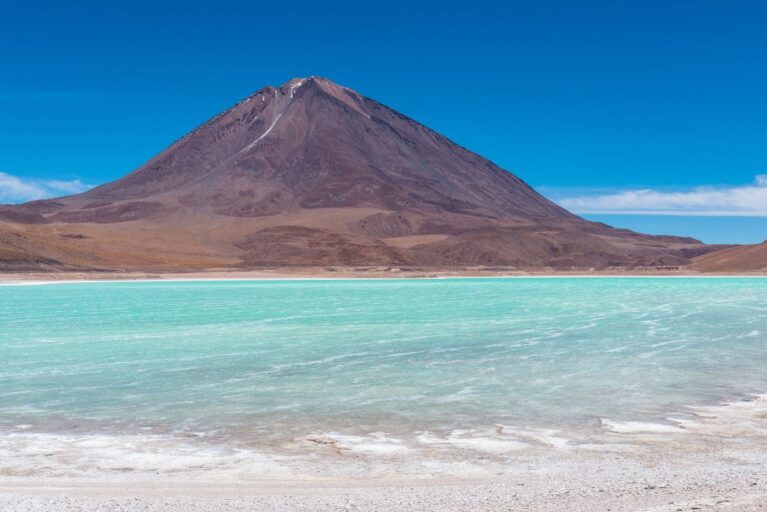 Laguna Verde with a mountain in the background in Uyuni