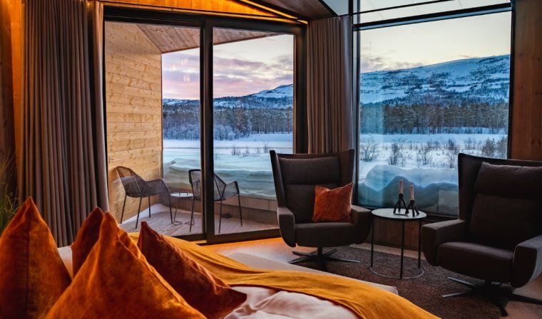 Luxury suite with views of Arctic landscapes surrounding Sorrisniva Arctic Wilderness Lodge