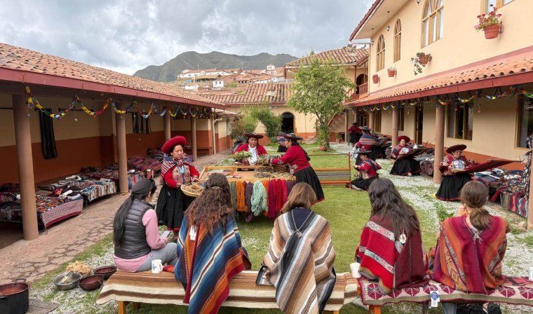 Luxury travel advisors join local Peruvian women for a traditional weaving lesson