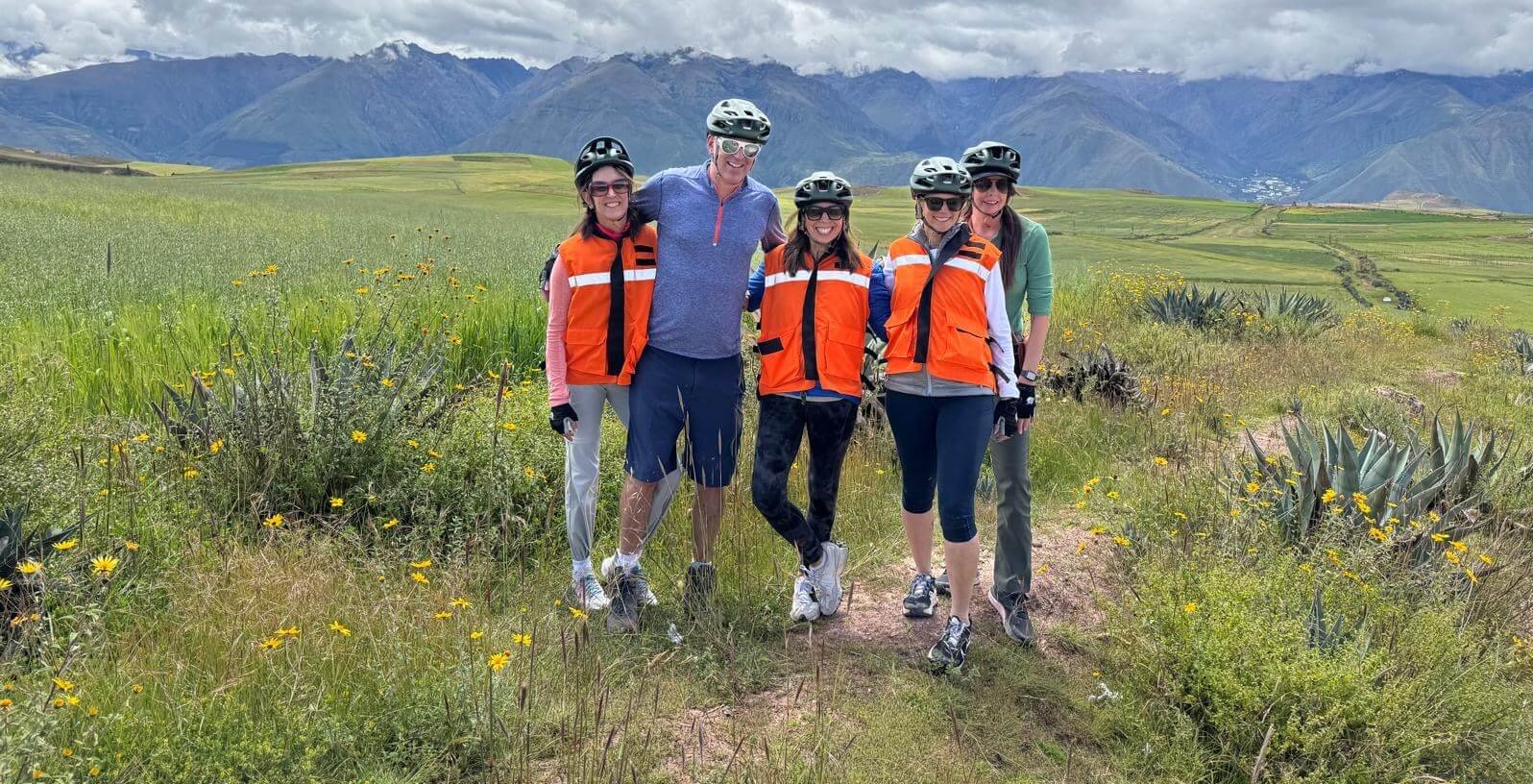 Active bikers standing in the Sacred Valley in Peru following an exciting biking adventure in Peru