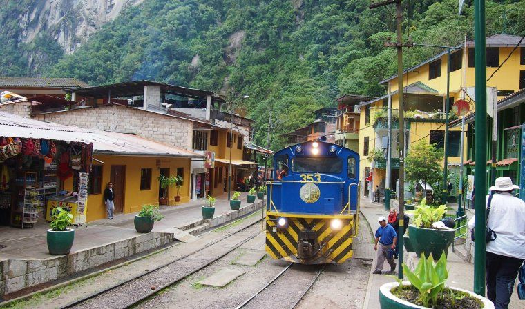 View of the Vistadome train entering the station at Machu Picchu in Peru