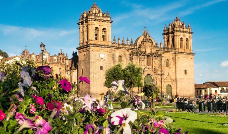 Cathedral in Cusco's busy main square during the day