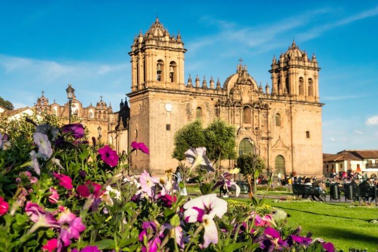 Cathedral in Cusco's busy main square during the day