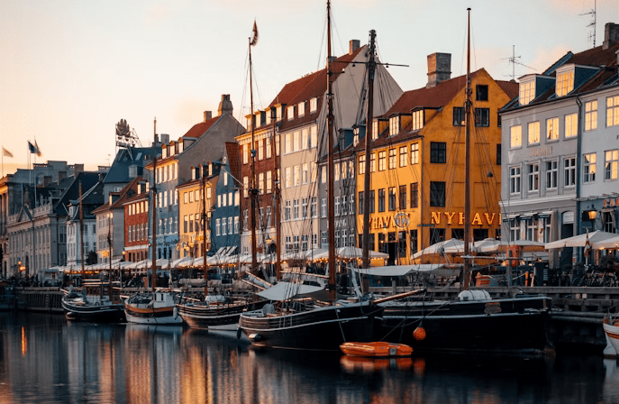 View of colorful houses in Copenhagen from the river during luxury tour of Scandinavia