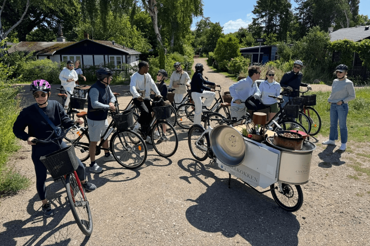 Family enjoying culinary biking tour during luxury tour of Scandinavia