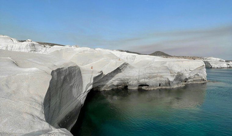 View of white cliffs and blue ocean at Sarakiniko Beach in Milos in Greece