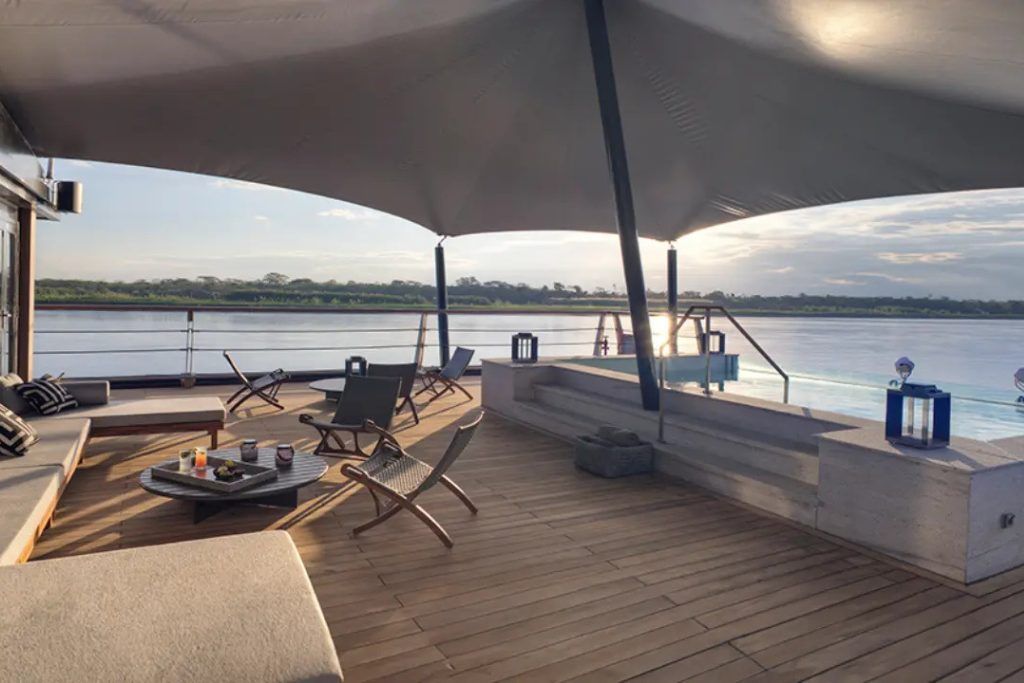 Outdoor deck at sunset on the Aqua Nera luxury boat in the Peruvian Amazon