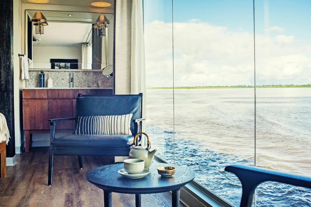 View of Amazon River from a private suite on the luxury Aria boat in Peru