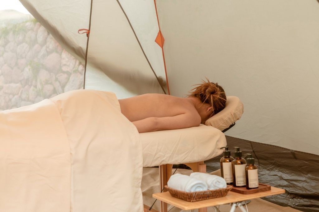 Woman receiving massage at private luxury camp along the Inca Trail