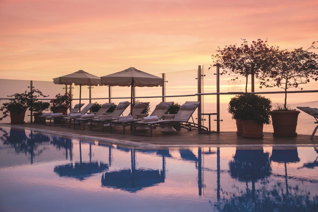 Sunset over rooftop pool at Lima's luxury Miraflores Park Hotel in Peru